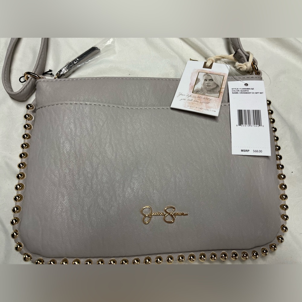 Jessica Simpson purse. Grey with gold accents. New with tags.